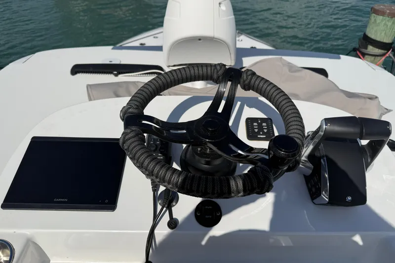  Yacht Photos Pics Helm of 2024 SeaHunter 35 Tournament boat with steering wheel and controls.