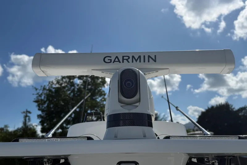  Yacht Photos Pics 2024 SeaHunter 35 Tournament boat with Garmin radar against a clear blue sky.