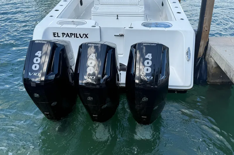  Yacht Photos Pics 2024 SeaHunter 35 Tournament with triple Mercury 400 V10 engines docked in water.