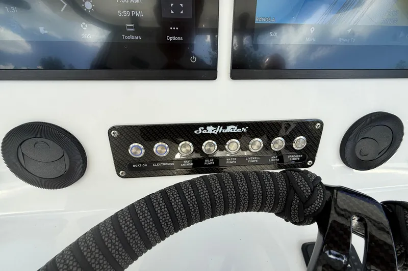  Yacht Photos Pics Control panel of 2024 SeaHunter 35 Tournament boat with switches and displays.