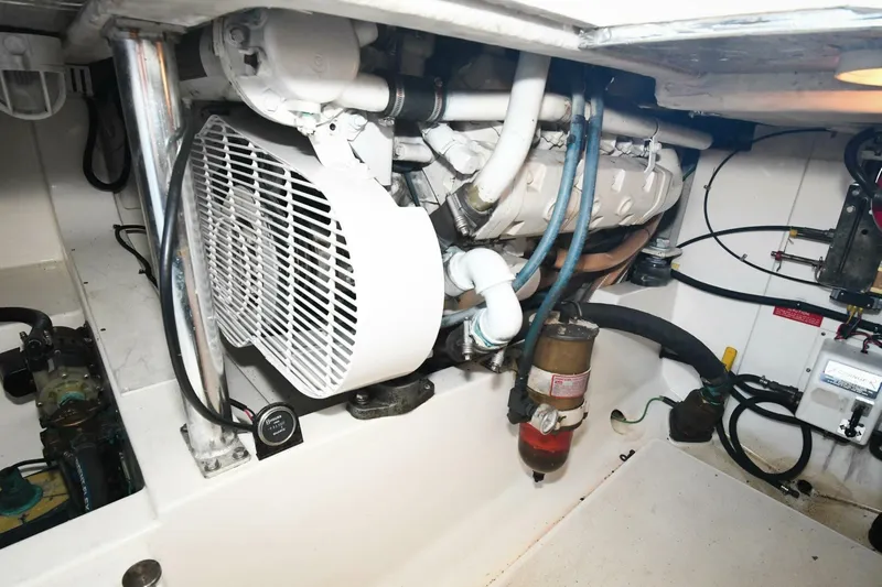 Vikingos Yacht Photos Pics Engine room of a 2001 Cabo 35 Flybridge boat with visible machinery and components.
