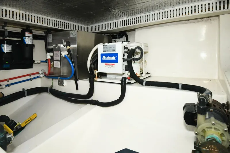 Vikingos Yacht Photos Pics Engine room of a 2001 Cabo 35 Flybridge boat with Cruisair system.