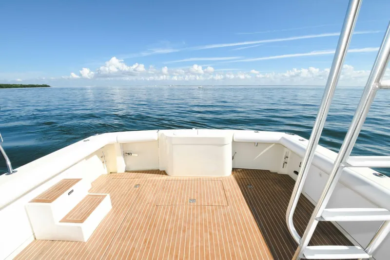 Vikingos Yacht Photos Pics 2001 Cabo 35 Flybridge boat deck with ocean view.