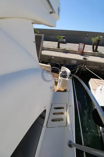 C Yacht Photos Pics 1999 Azimut 42 yacht docked, showcasing sleek design and marina setting.