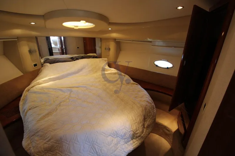 C Yacht Photos Pics Luxurious cabin interior of a 1999 Azimut 42 yacht with cozy bedding.