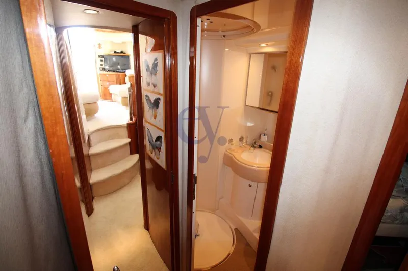 C Yacht Photos Pics Interior of 1999 Azimut 42 yacht showing bathroom and staircase with butterfly decor.