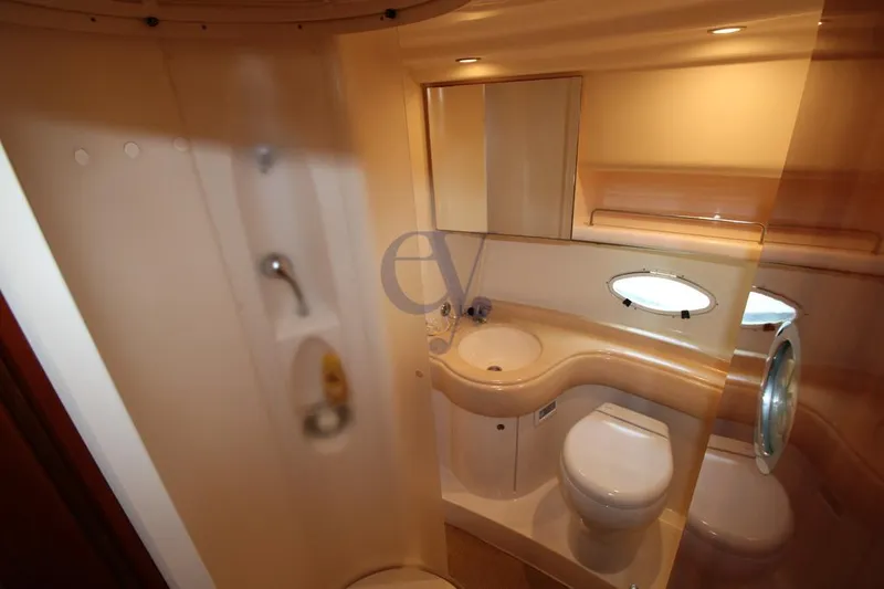 C Yacht Photos Pics 1999 Azimut 42 yacht bathroom with modern fixtures and compact design.