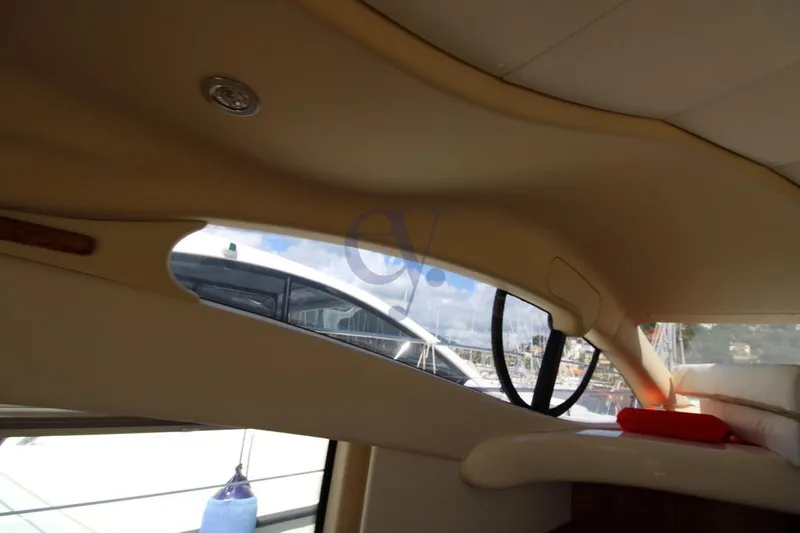 C Yacht Photos Pics Interior view of a 1999 Azimut 42 yacht, showcasing sleek window design.