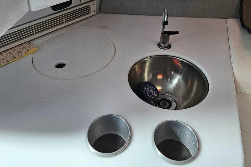  Yacht Photos Pics 2004 Formula 382 FASTech boat interior with sink and cup holders.