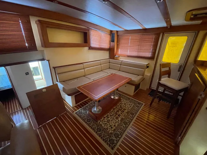 Endurance Yacht Photos Pics Interior of 2006 Duffy Pilothouse Fast Trawler with wood accents and cozy seating area.