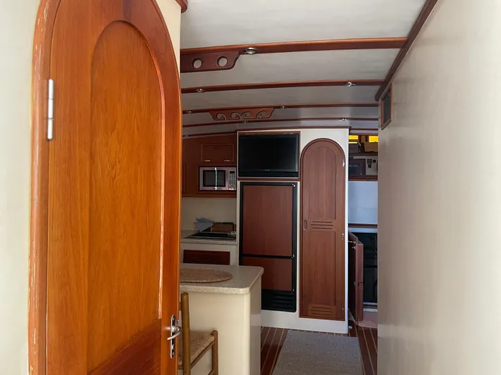 Endurance Yacht Photos Pics Interior of 2006 Duffy Pilothouse Fast Trawler with wooden cabinetry and modern appliances.