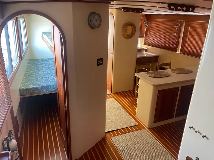 Endurance Yacht Photos Pics Interior of 2006 Duffy Pilothouse Fast Trawler with wood flooring and cozy cabin layout.