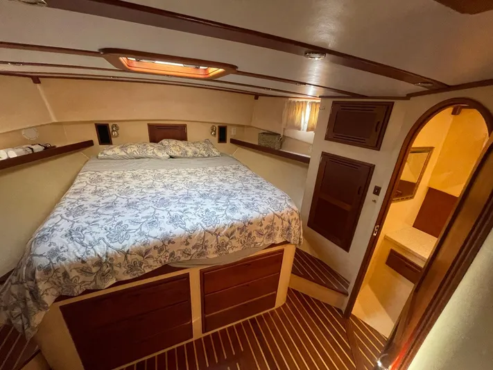 Endurance Yacht Photos Pics Luxurious bedroom in 2006 Duffy Pilothouse Fast Trawler with elegant wood accents.