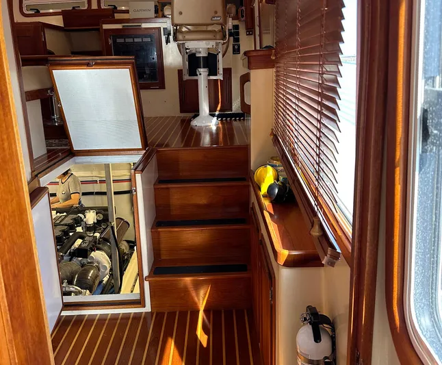 Endurance Yacht Photos Pics Interior of 2006 Duffy Pilothouse Fast Trawler with wooden stairs and engine access.