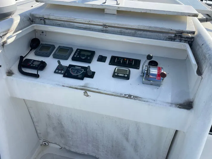 Endurance Yacht Photos Pics Control panel of a 2006 Duffy Pilothouse Fast Trawler with navigation instruments and radio.