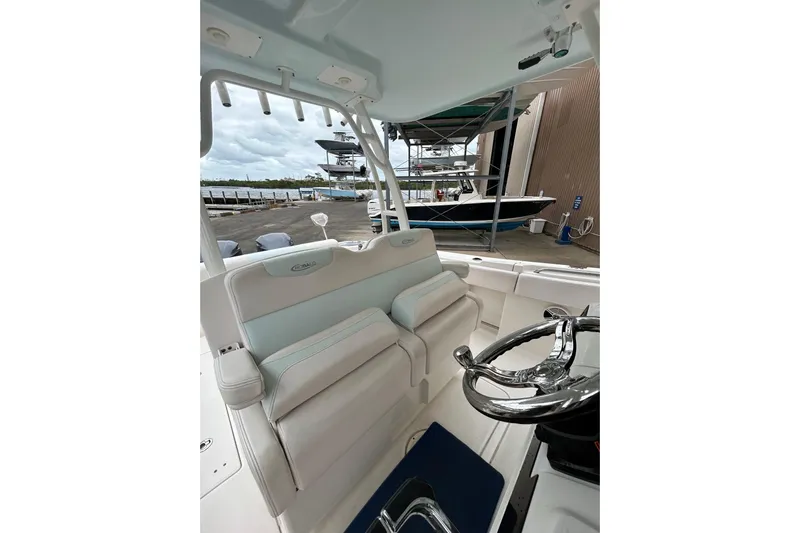302-176 Brokerage Anthony Yacht Photos Pics 2018 Robalo R302 Center Console boat interior with steering wheel and seating.