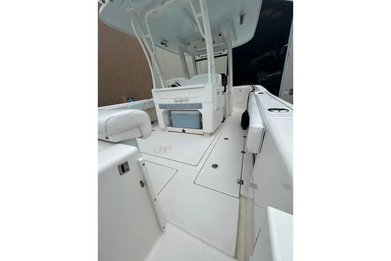 302-176 Brokerage Anthony Yacht Photos Pics 2018 Robalo R302 Center Console boat interior with seating and storage compartments.
