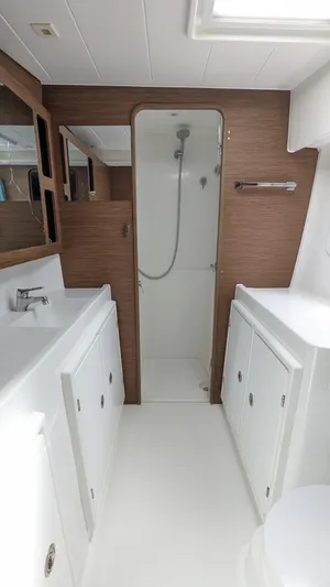 Solace Yacht Photos Pics Modern bathroom in 2020 Lagoon 42 yacht with sleek design and wood accents.