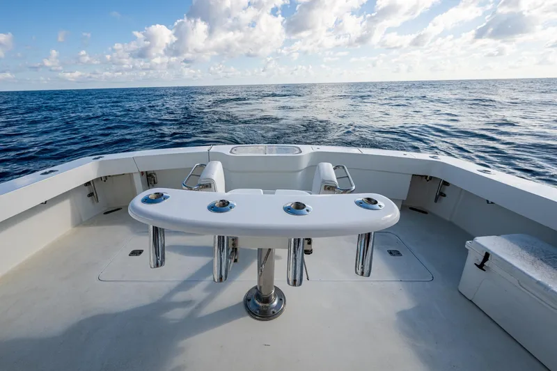 Navigator Yacht Photos Pics 1998 Viking 50 Convertible yacht deck with ocean view and fishing rod holders.