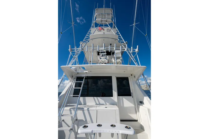 Navigator Yacht Photos Pics 1998 Viking 50 Convertible yacht with tower against clear blue sky.