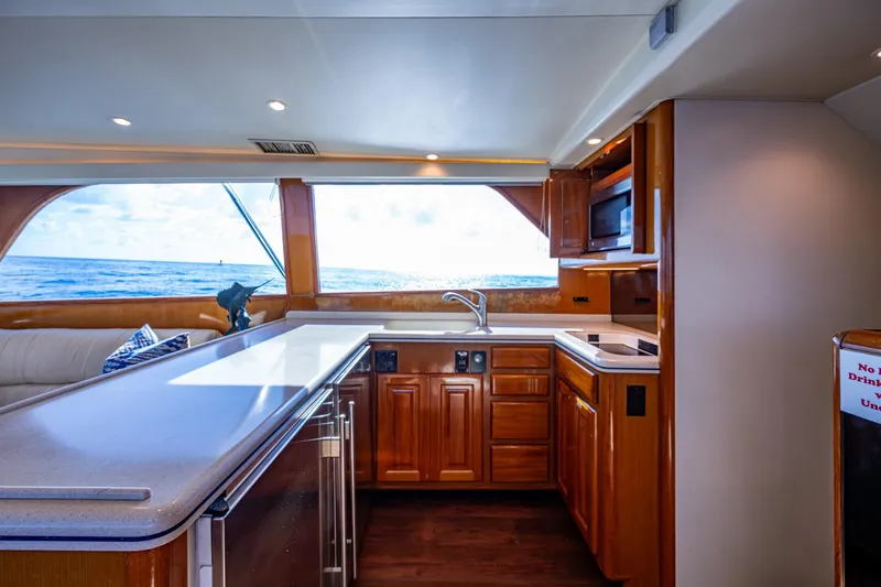 Navigator Yacht Photos Pics Luxurious kitchen interior of 1998 Viking 50 Convertible yacht with ocean view.