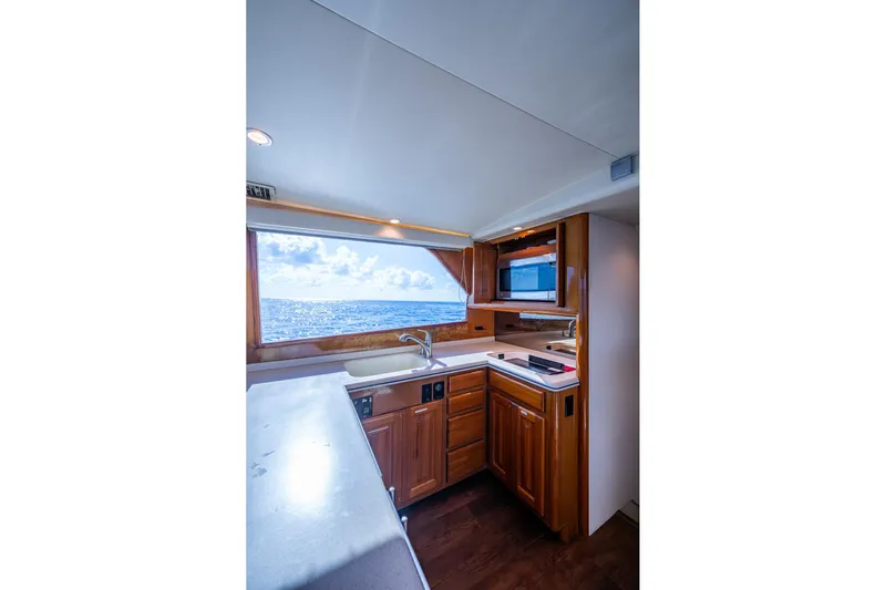 Navigator Yacht Photos Pics Interior of 1998 Viking 50 Convertible yacht kitchen with ocean view.