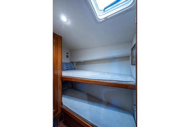 Navigator Yacht Photos Pics 1998 Viking 50 Convertible yacht interior with bunk beds and skylight.
