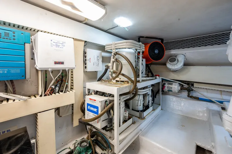Navigator Yacht Photos Pics Engine room of a 1998 Viking 50 Convertible yacht, featuring mechanical equipment and wiring.