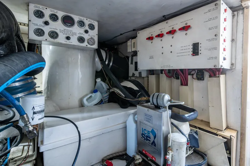 Navigator Yacht Photos Pics Engine room of 1998 Viking 50 Convertible boat with control panels and equipment.