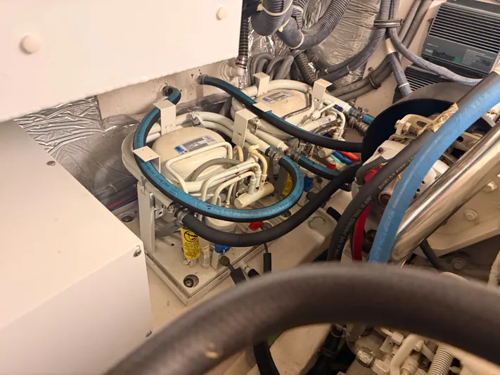 Gonzo Yacht Photos Pics Engine room of 2004 Tiara Yachts 42 Open with hoses and cables.