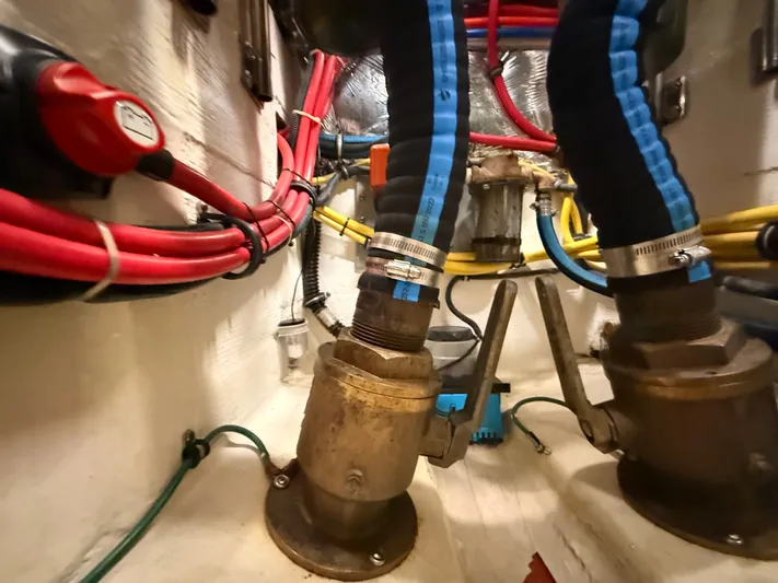 Gonzo Yacht Photos Pics Engine room of 2004 Tiara Yachts 42 Open with hoses and valves.