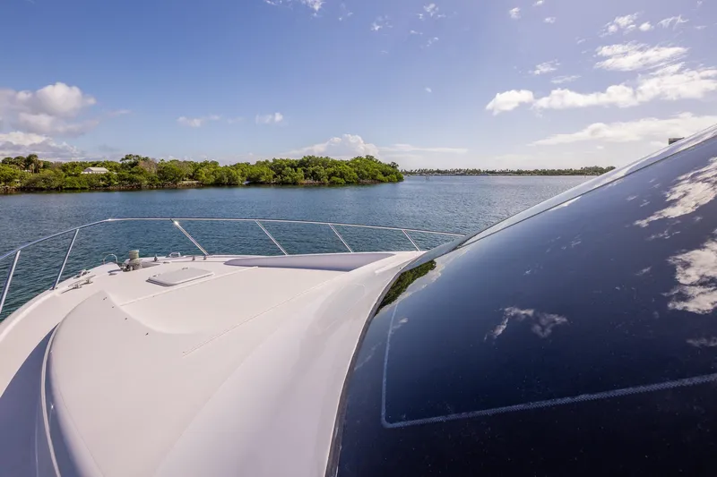 Starka Yacht Photos Pics Bow view of 2009 Hatteras 64 Motor Yacht cruising on a sunny day.