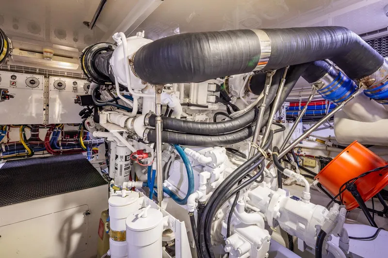 Starka Yacht Photos Pics Engine room of 2009 Hatteras 64 Motor Yacht with complex machinery and piping.