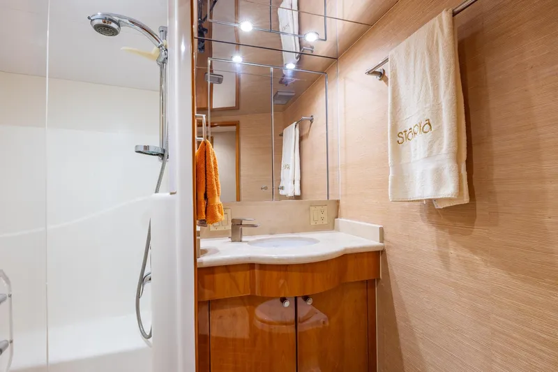 Starka Yacht Photos Pics Luxurious bathroom in 2009 Hatteras 64 Motor Yacht with modern fixtures and elegant design.
