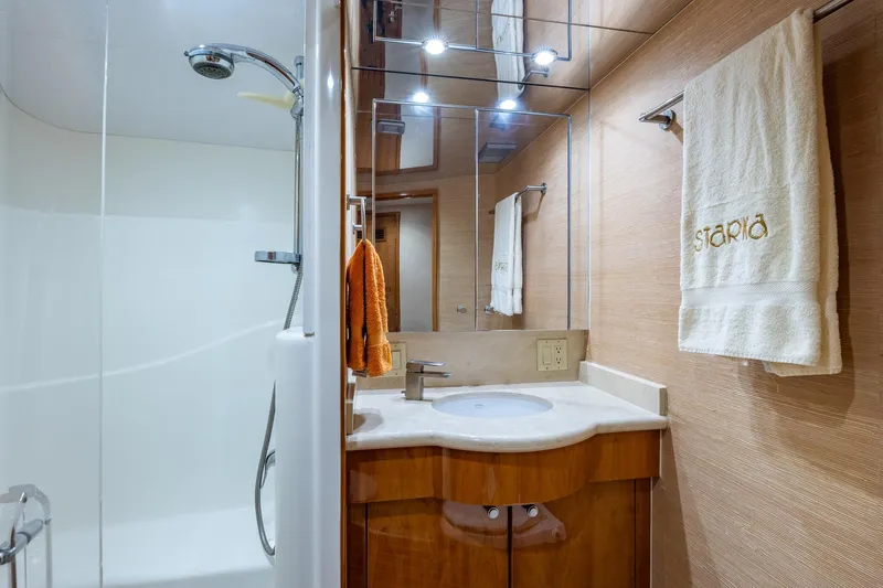 Starka Yacht Photos Pics Luxurious bathroom in 2009 Hatteras 64 Motor Yacht with modern fixtures and elegant design.
