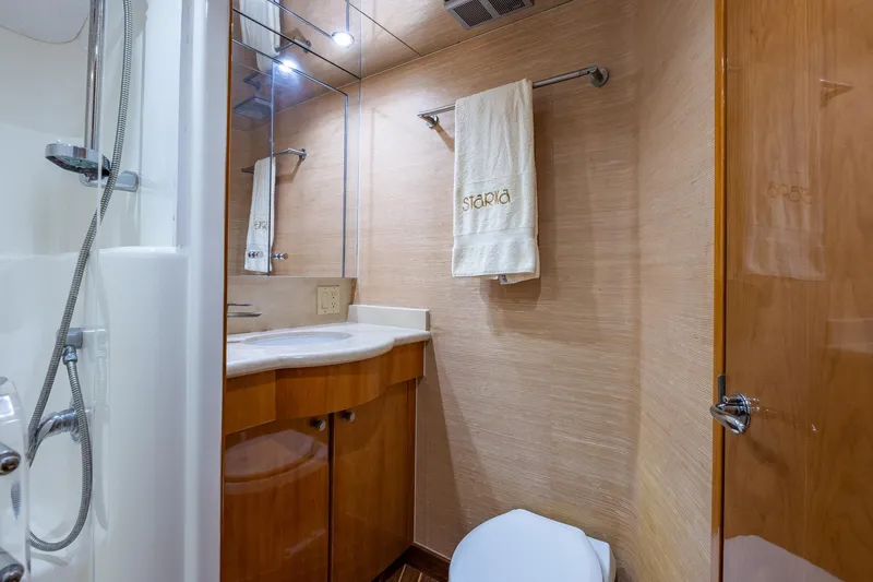 Starka Yacht Photos Pics Luxurious bathroom in 2009 Hatteras 64 Motor Yacht with modern fixtures and elegant design.
