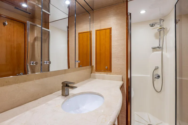 Starka Yacht Photos Pics Luxurious bathroom in 2009 Hatteras 64 Motor Yacht with modern fixtures and shower.