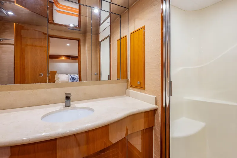 Starka Yacht Photos Pics Luxurious bathroom in 2009 Hatteras 64 Motor Yacht with modern fixtures and elegant design.