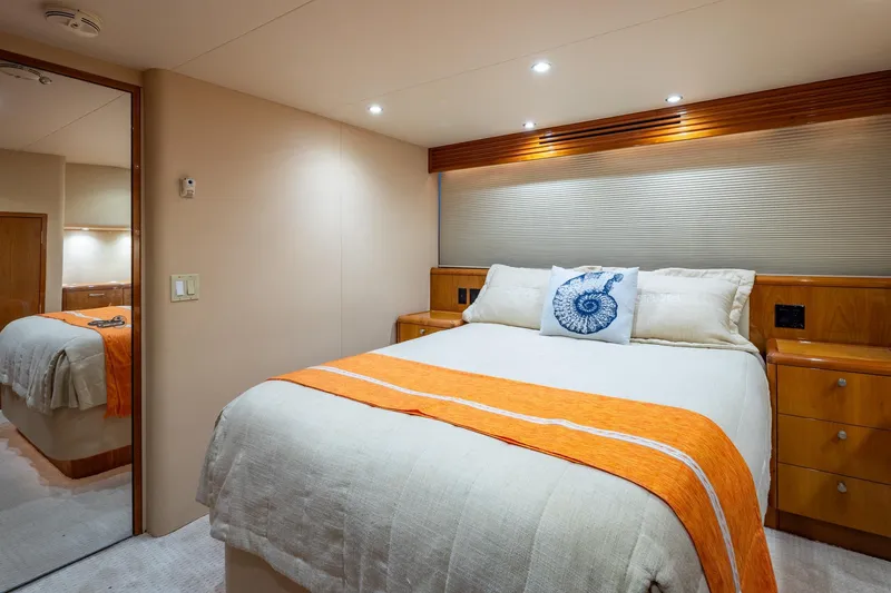 Starka Yacht Photos Pics Luxurious bedroom in 2009 Hatteras 64 Motor Yacht with elegant decor and cozy bedding.