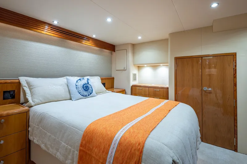 Starka Yacht Photos Pics Luxurious bedroom interior of 2009 Hatteras 64 Motor Yacht with modern design elements.