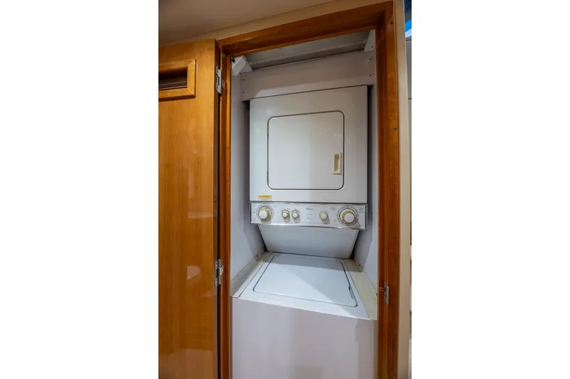 Starka Yacht Photos Pics Stacked washer and dryer in 2009 Hatteras 64 Motor Yacht laundry area.