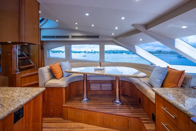 Starka Yacht Photos Pics Luxurious interior of 2009 Hatteras 64 Motor Yacht with panoramic windows and elegant seating.