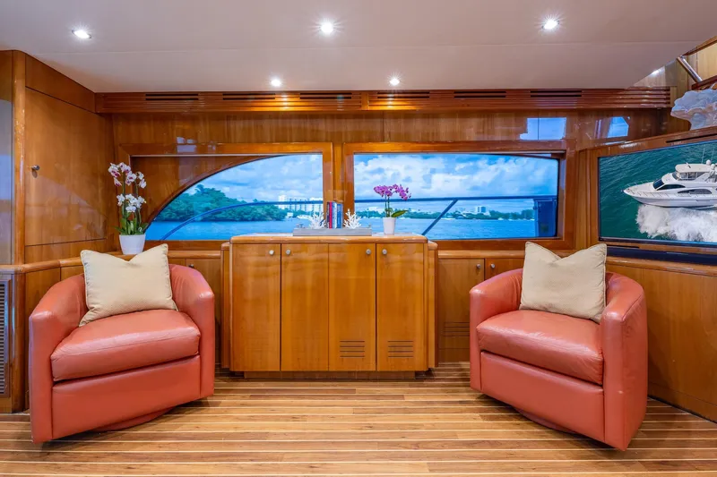 Starka Yacht Photos Pics Luxurious 2009 Hatteras 64 Motor Yacht interior with plush seating and elegant wood finishes.