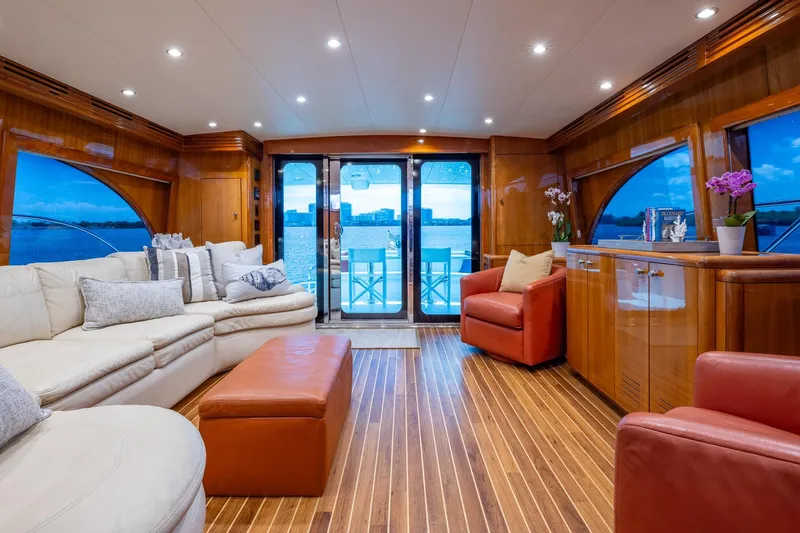 Starka Yacht Photos Pics Luxurious interior of 2009 Hatteras 64 Motor Yacht with elegant seating and wood finishes.