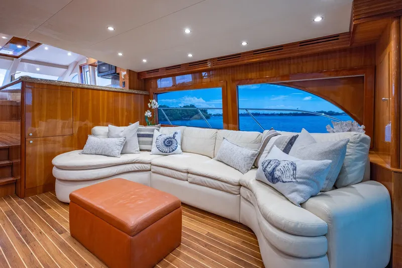 Starka Yacht Photos Pics Luxurious interior of 2009 Hatteras 64 Motor Yacht with plush seating and elegant wood finishes.