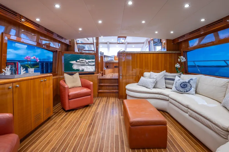 Starka Yacht Photos Pics Luxurious interior of 2009 Hatteras 64 Motor Yacht with elegant seating and wooden finishes.