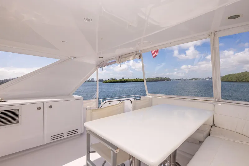 Starka Yacht Photos Pics Luxurious 2009 Hatteras 64 Motor Yacht interior with ocean view and elegant seating area.