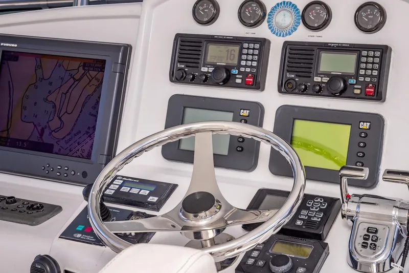 Starka Yacht Photos Pics Control panel of 2009 Hatteras 64 Motor Yacht with navigation and communication equipment.