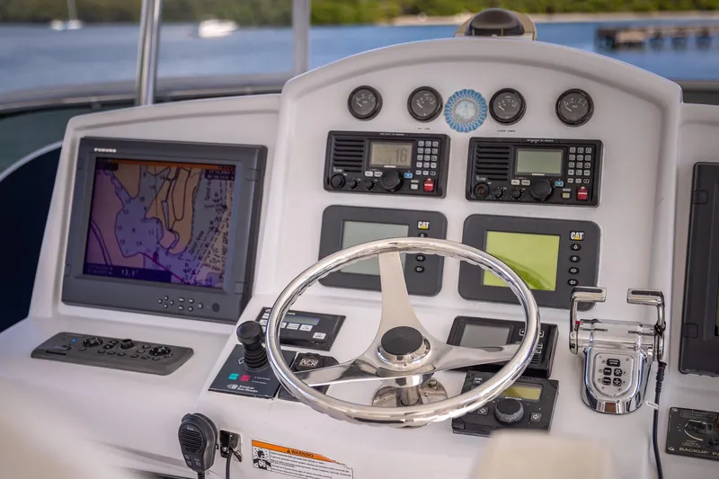 Starka Yacht Photos Pics Helm of 2009 Hatteras 64 Motor Yacht with navigation and control systems.