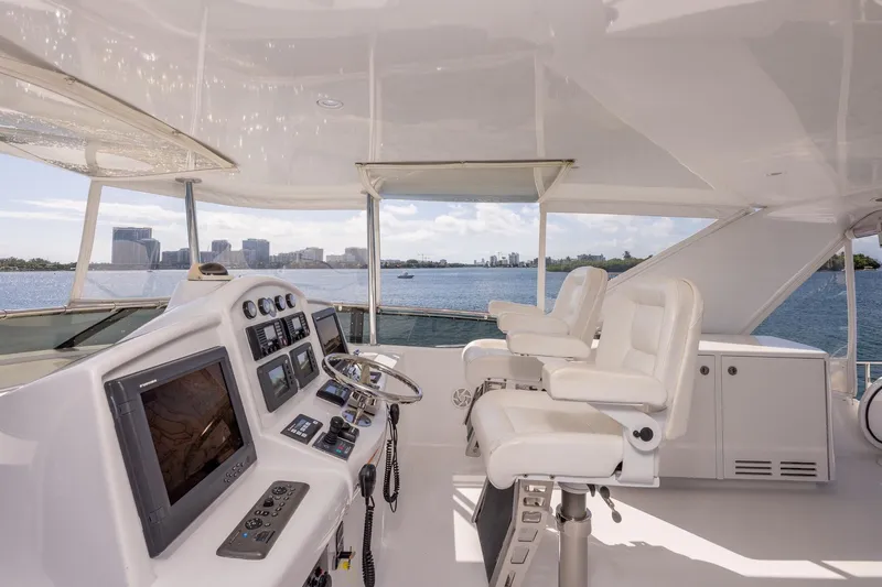 Starka Yacht Photos Pics Helm of 2009 Hatteras 64 Motor Yacht with city skyline view.